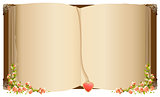 Old open book with bookmark in heart shape. Retro old book decorated with flowers