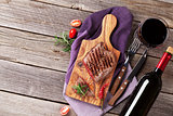 Grilled steak with spices and wine
