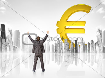 Businessman in front of big euro