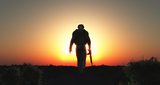 3D soldier walking at sunset