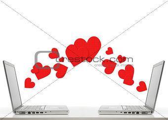 two laptops with hearts