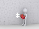 Person and last puzzle piece of wall