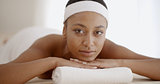 African Woman Laying On Spa Table