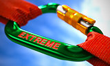 Extreme on Green Carabiner between Red Ropes.