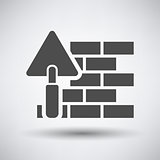 Brick wall with trowel icon