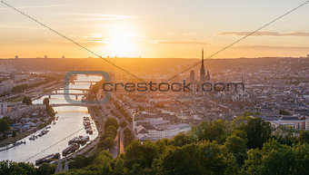 Panorama of the city of Rouen at sunset with the cathedral and the Seine.