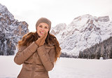 Portrait of smiling woman outdoors among snow-capped mountains