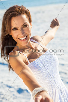 Beautiful Brunette Woman Laughing On A Beach