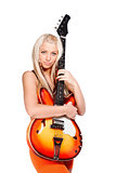 Teenage girl holding a bass guitar