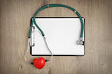 Clipboard with stethoscope and heart shape