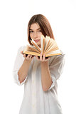 young woman holding book with open pages