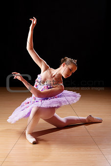 Teenage girl performing ballet in studio