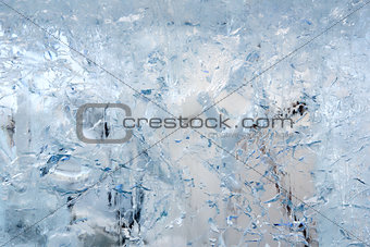 Glacial transparent block of ice with patterns.