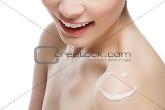 Cream smiley face on girl shoulder