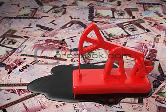 Red Pumpjack And Spilled Oil On Saudi Riyals