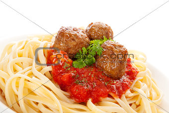 Pasta with tomato sauce and meatballs.