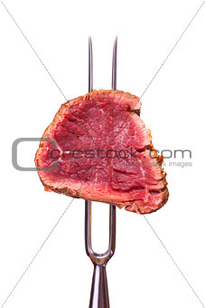 piece of steak on a meat fork 