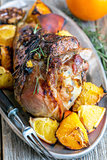 Thigh of turkey baked with oranges.
