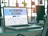 Accounting Records on Laptop in Modern Workplace Background.