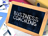 Handwritten Business Coaching on a Chalkboard.