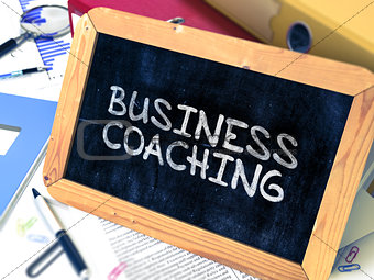 Handwritten Business Coaching on a Chalkboard.
