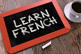 Learn French Concept Hand Drawn on Chalkboard.
