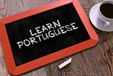 Learn Portuguese Concept Hand Drawn on Chalkboard.