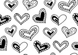 Seamless pattern with the hand drawn ink doodle hearts.