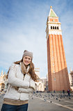 Portrait of woman standing in front of Campanile di San Marco