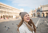Laughing woman standing on Piazza San Marco