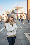 Happy young woman spending time on Piazza San Marco, Venice