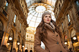 Woman in Galleria Vittorio Emanuele II looking into distance