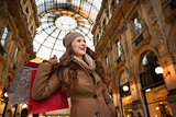 Young woman with shopping bags in Galleria Vittorio Emanuele II