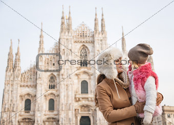 Mother and daughter near Duomo spending time sightseeing Milan