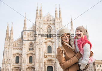 Portrait of mother and daughter in front of Duomo in Milan