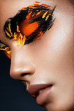 Beauty fashion model girl with dark bright orange make-up