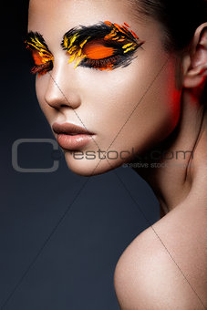 Beauty fashion model girl with dark bright orange make-up