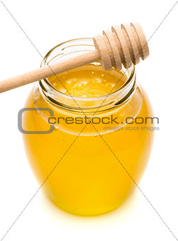 Natural honey in a glass jar, spoon for honey