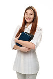 young woman holding books smiling