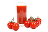 Tomato juice and bunch of tomatoes over white.
