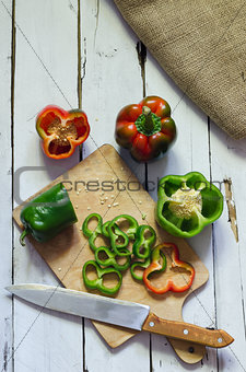 Photo of sliced peppers over wooden table