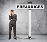 Businessman word prejudice on post sign