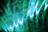 Ice figure close up, the surface is lit from inside with green light