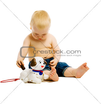 Baby boy playing with toys. isolated