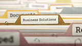 Business Solutions Concept on File Label.