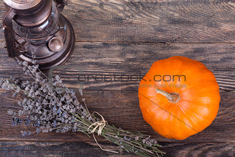 Yellow pumpkin with lavender and lantern
