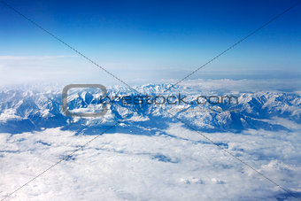 Winter mountains and white clouds 