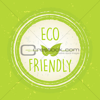 eco friendly with leaf sign in circle over green old paper backg