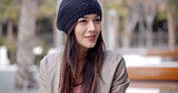 Cute smiling young woman in knitted hat