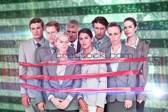 Composite image of upset business team fastened with adhesive tape